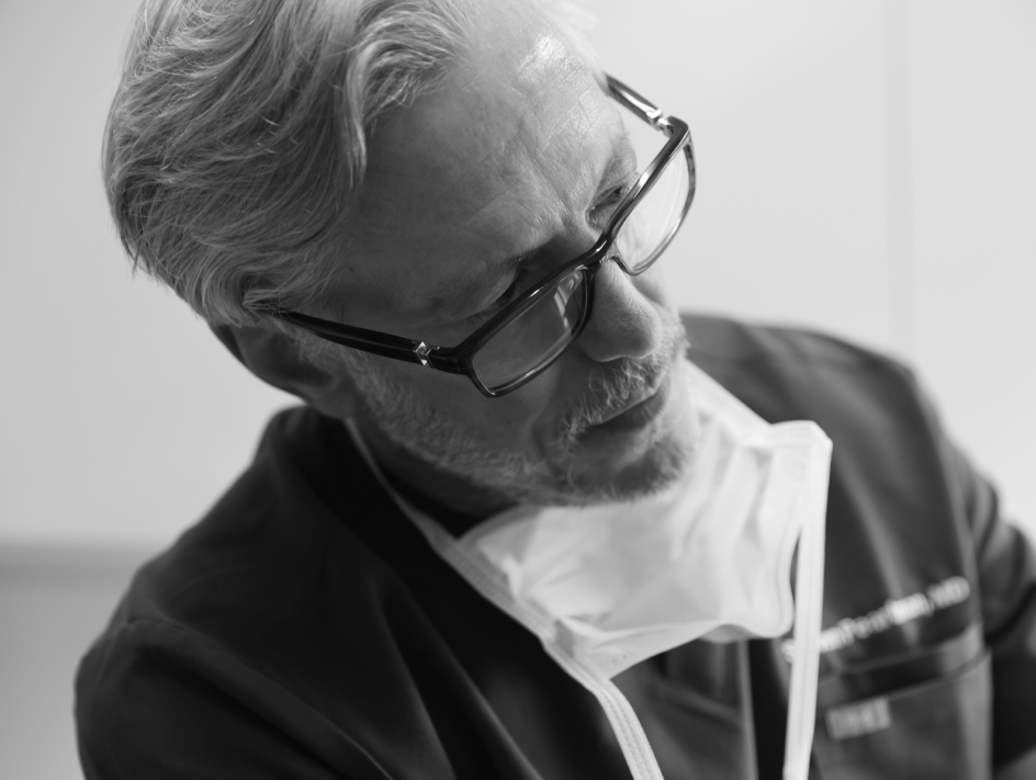 Dr. Pearlman edited leaning with a mask