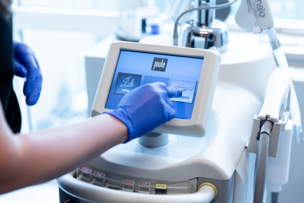 person in gloves using BBL Hero machine