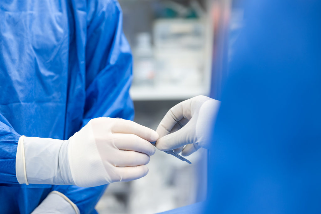 Dr. Stein Surgical tool being passed on