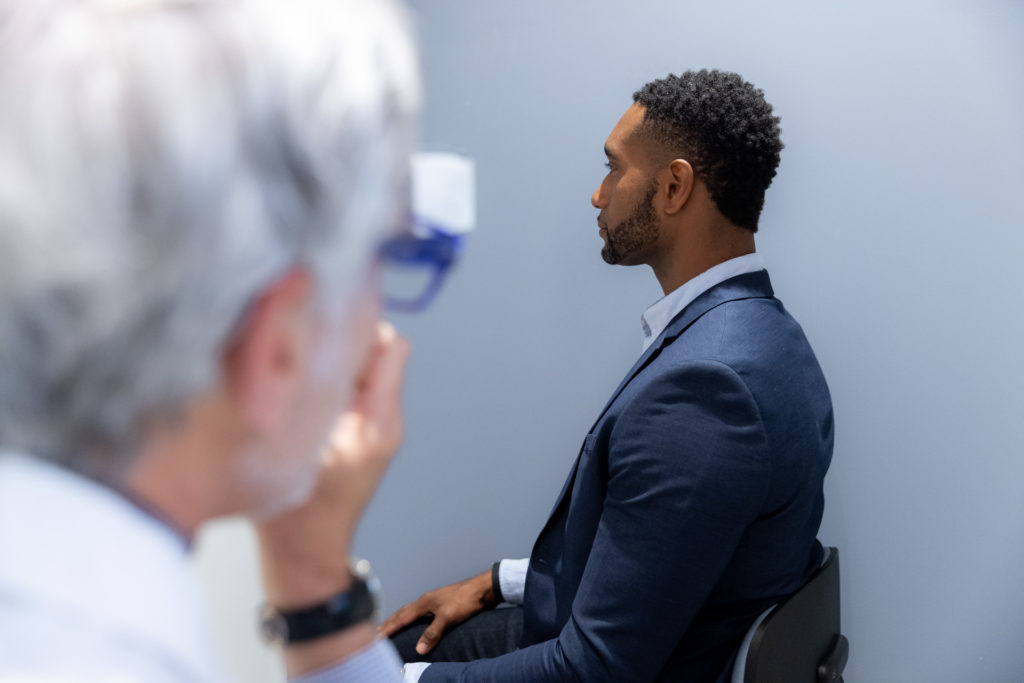 Dr. Pearlman taking picture of man's nose for septoplasty