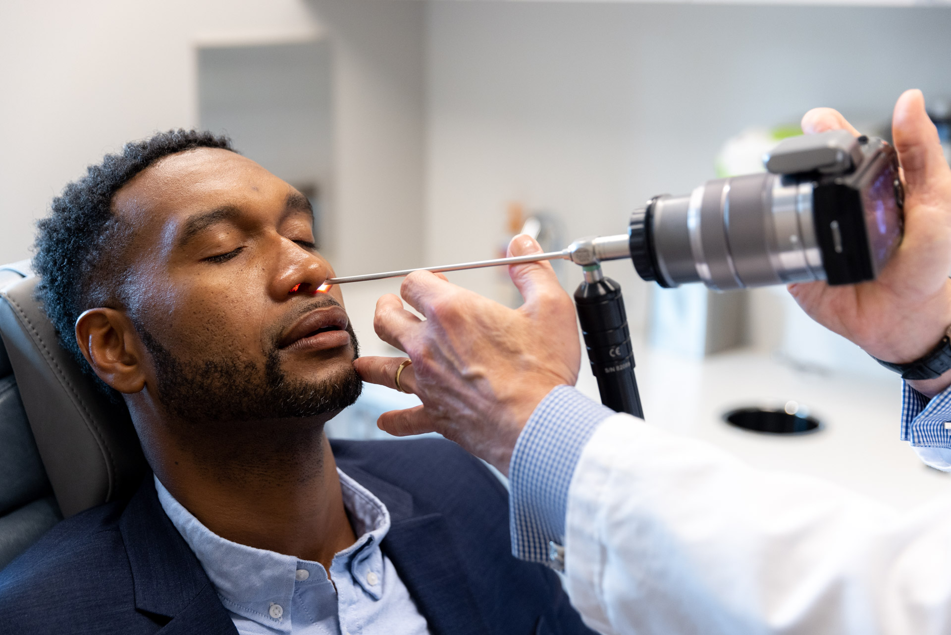 Dr. Pearlman using light tool for rhinoplasty