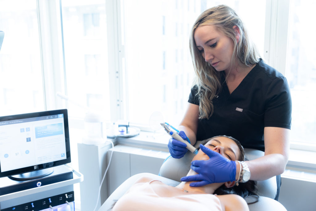 Hydrafacial with specialist performing the treatment on patient