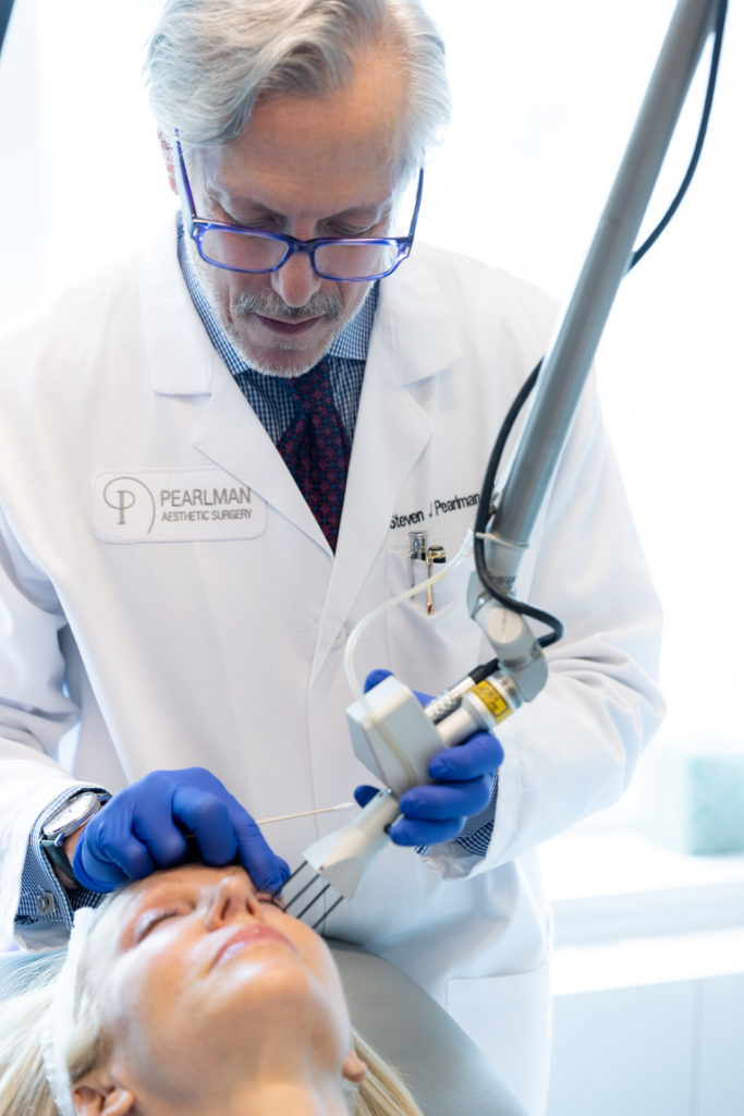 Laser Resurfacing device used by a specialist on their patient