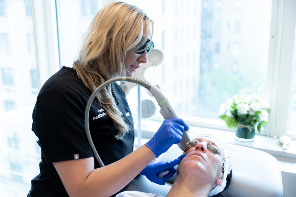 Laser Vein Treatment device being used by a specialist on their patient