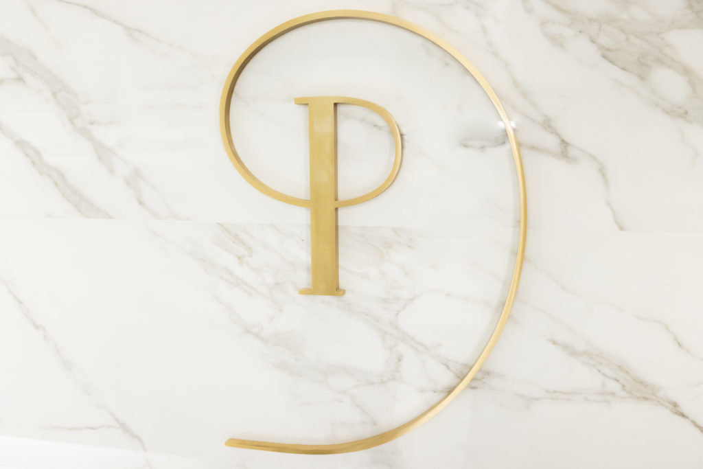 Pearlman golden P logo