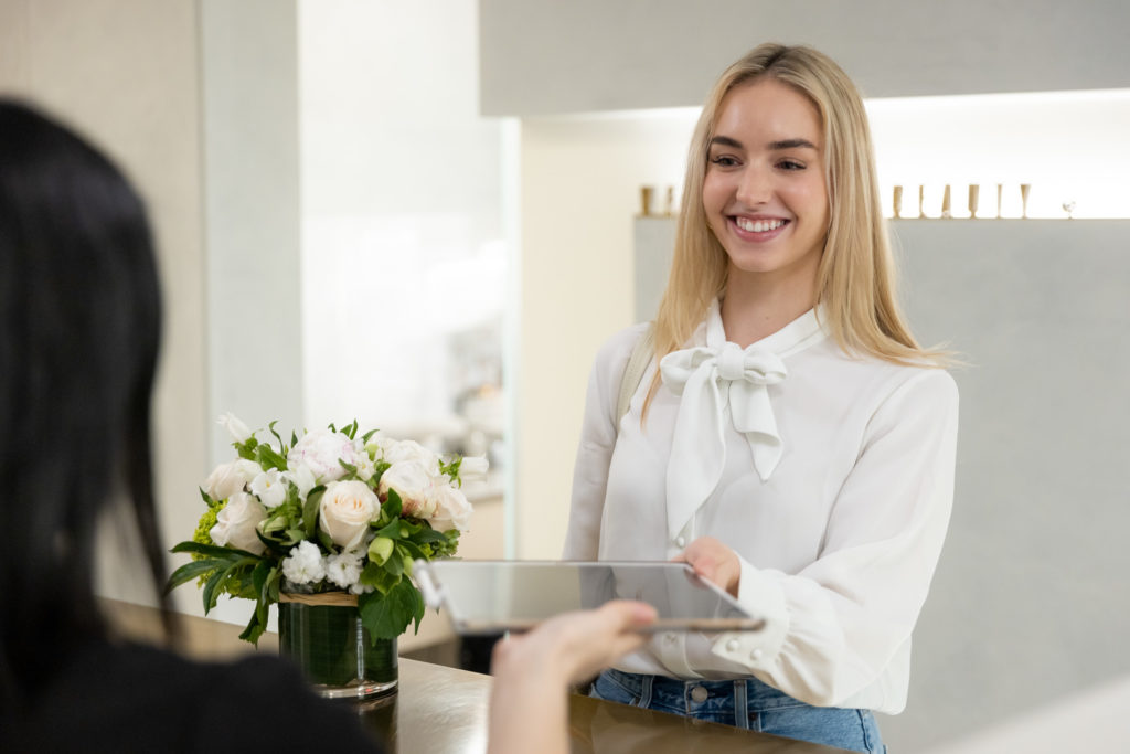 happy patient being given a tablet