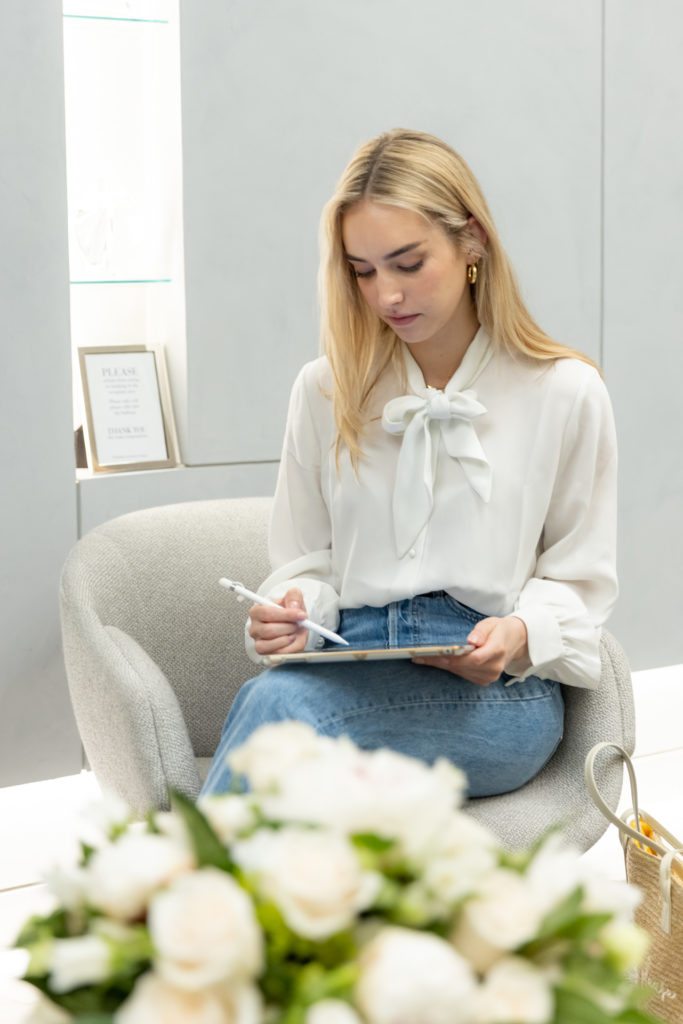 patient sitting in lounge using tablet