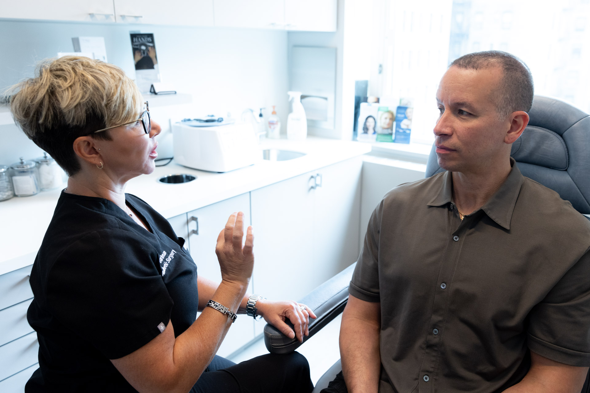 specialist having surgery consultation with male patient