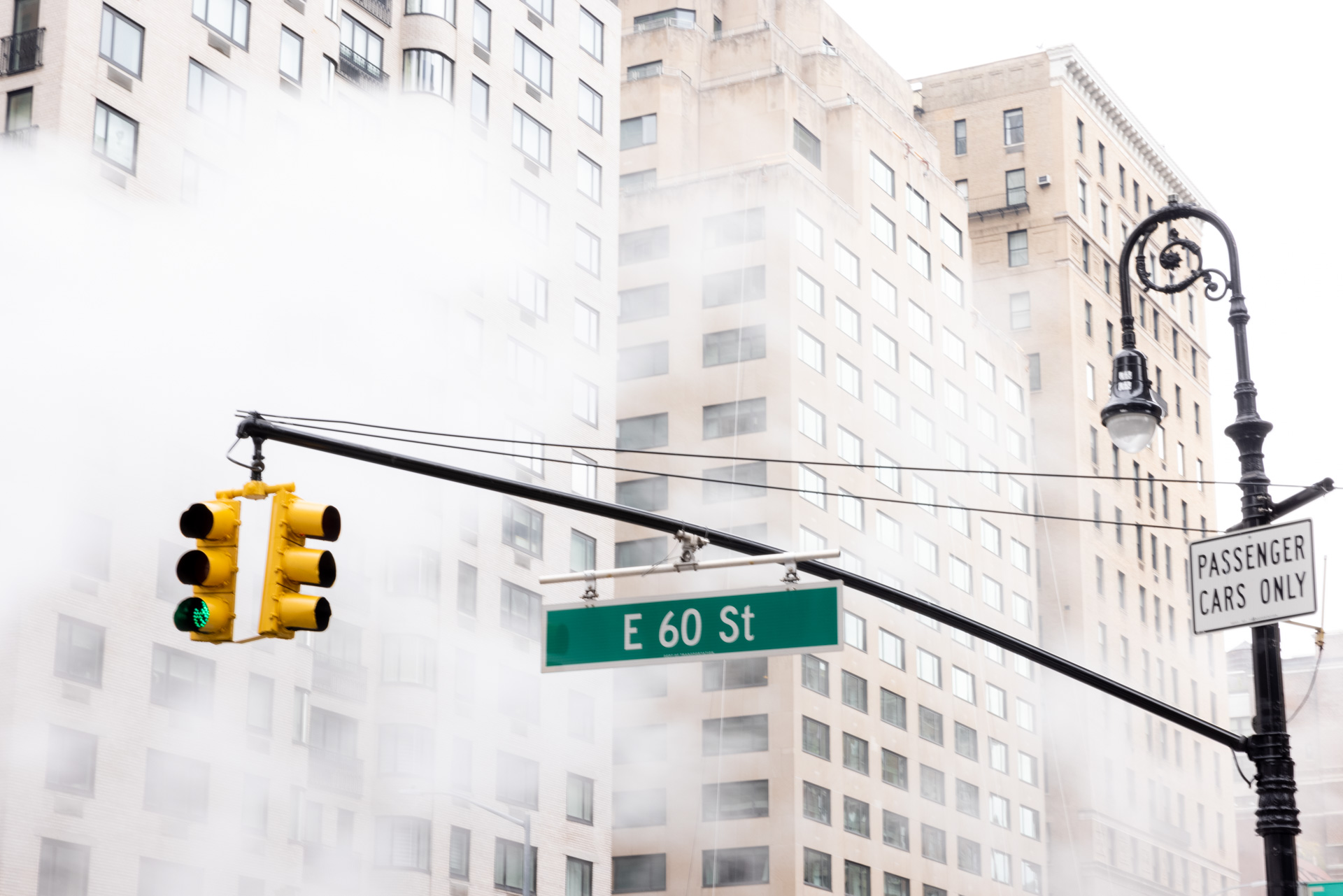city road sign and green light