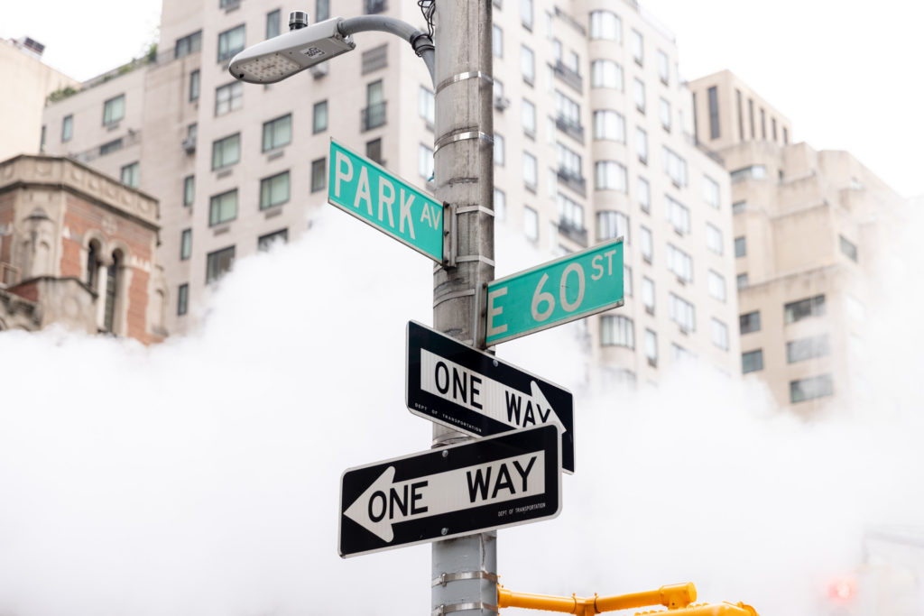 road signs in smoky city