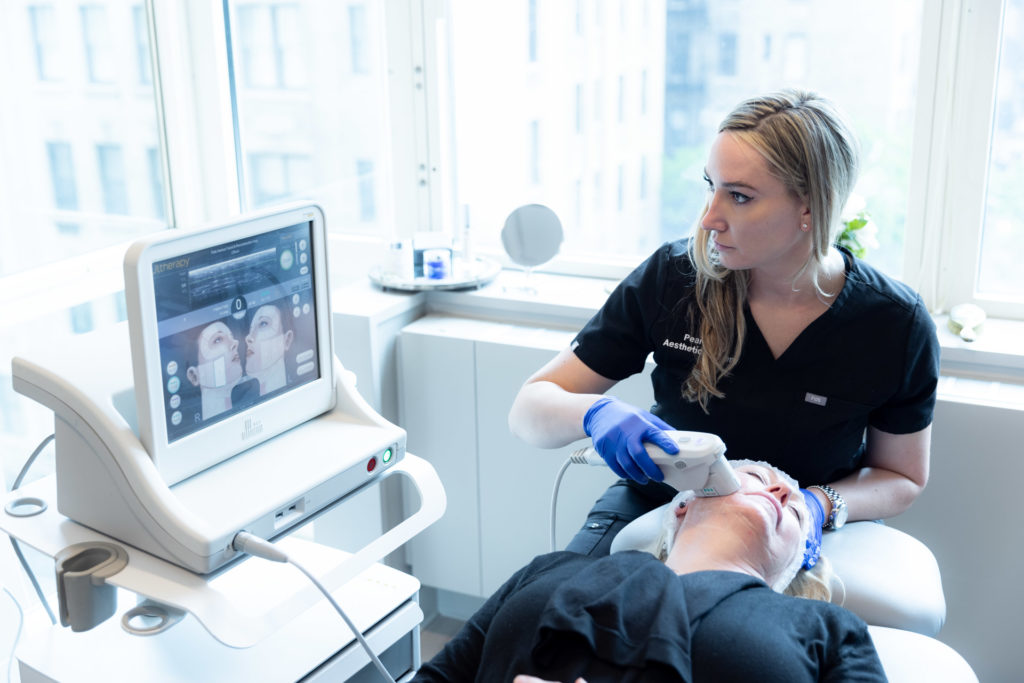 Ultherapy device being used by specialist on the client
