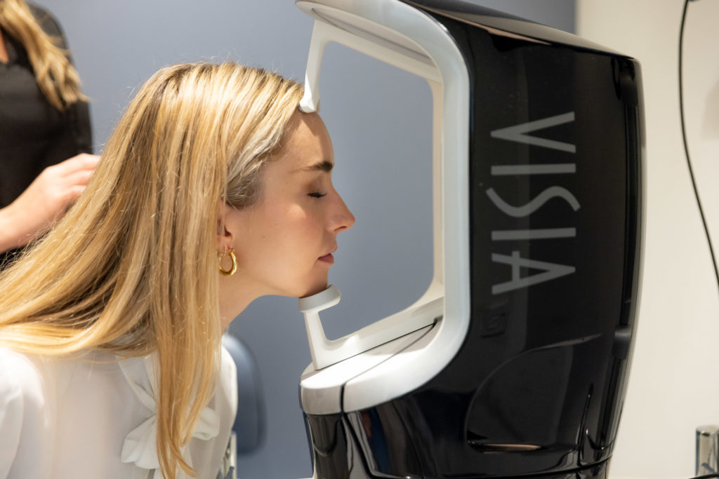 Visia with patient getting into the machine