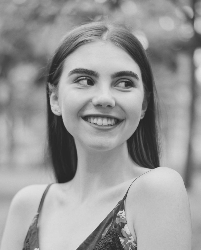 portrait of a smiling woman looking to the side